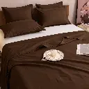 Cozy Chocolate Brown Bedroom Still Life.webp